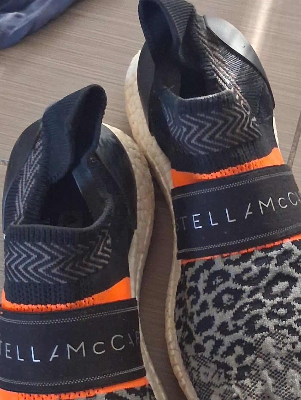 Stella McCartney & Adidas Collab Slip-On Sneakers in Black, White & Orange